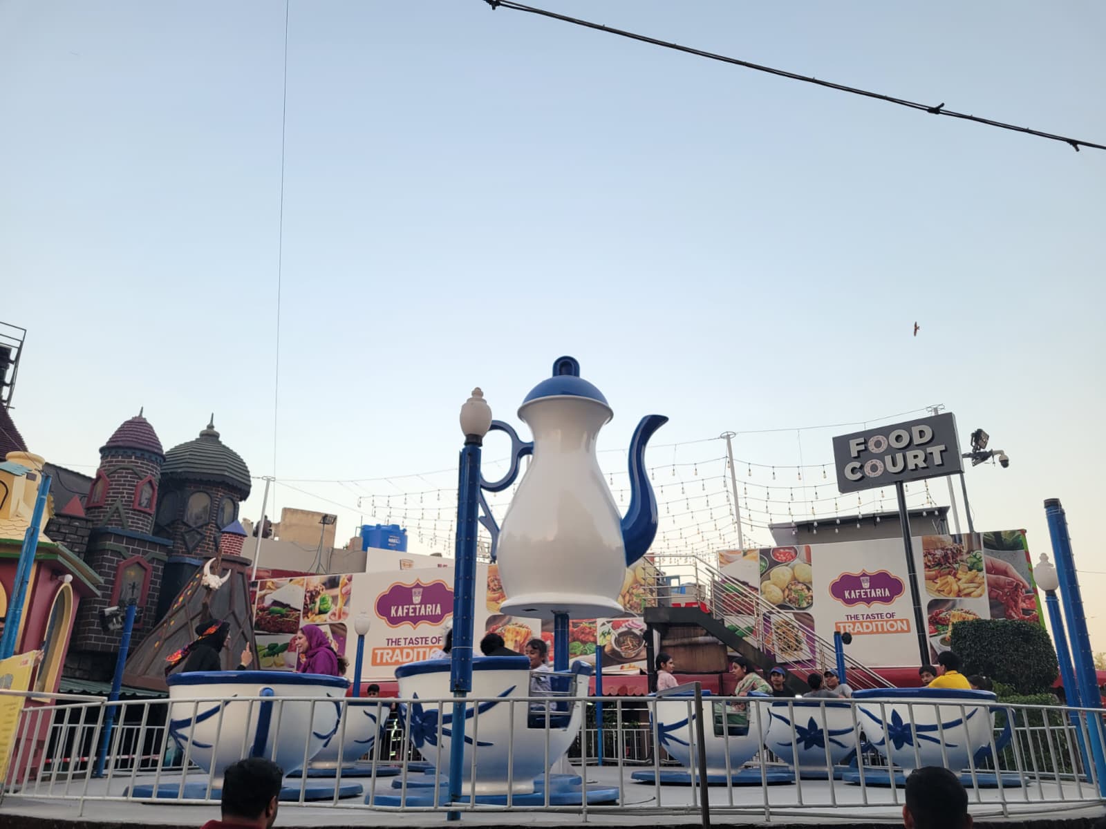 Joyland amusement park with teacup ride and food court